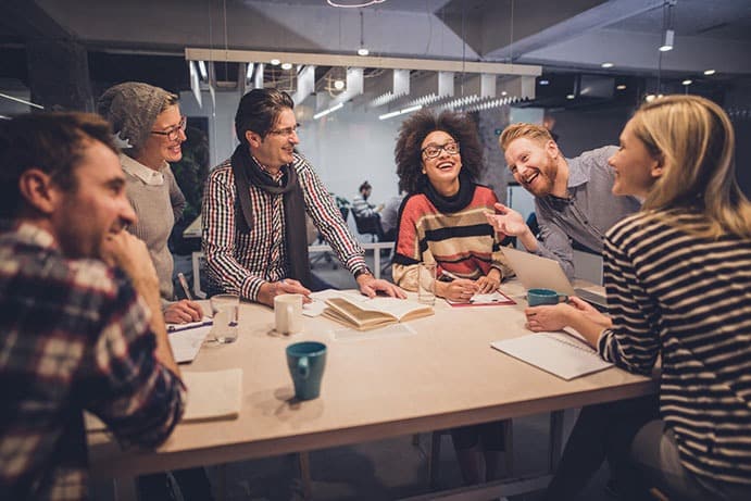 Six people playing team building game 