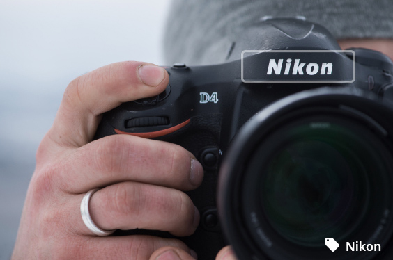 Photographer with Nikon camera - symbolic image brand recognition by artificial intelligence