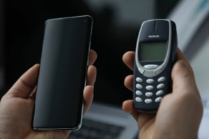 Symbolic image of digital transformation - Samsung Galaxy S10 versus Nokia 3310