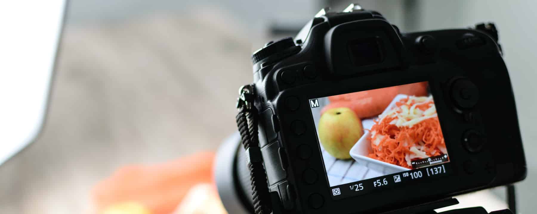 Display of professional camera during food recording - RAW format symbolic image