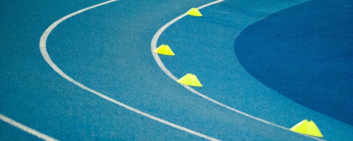 Tartan track in blue. Symbolic image for sports marketing events